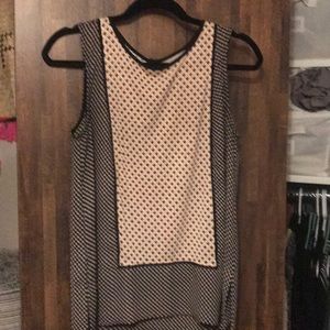 Pink and white sleeveless blouse